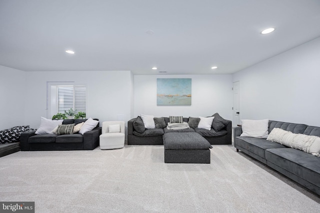 carpeted living area with recessed lighting