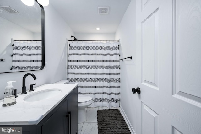 bathroom with vanity, toilet, visible vents, and marble finish floor