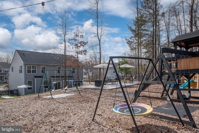 view of jungle gym featuring fence and a residential view