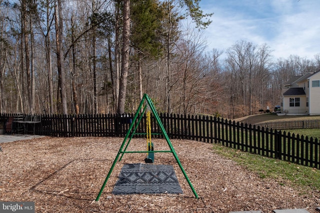 view of playground with a fenced backyard