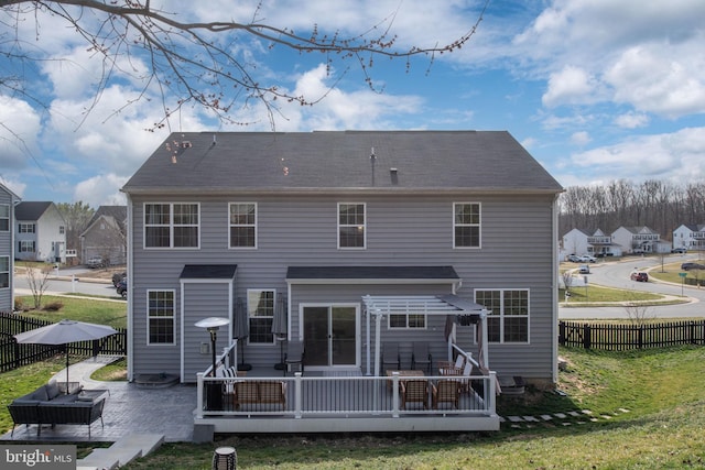 back of property with a patio area, a yard, and a fenced backyard