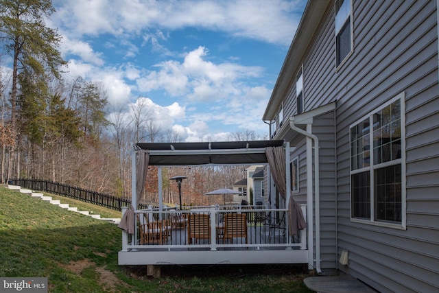 view of yard with fence and a wooden deck