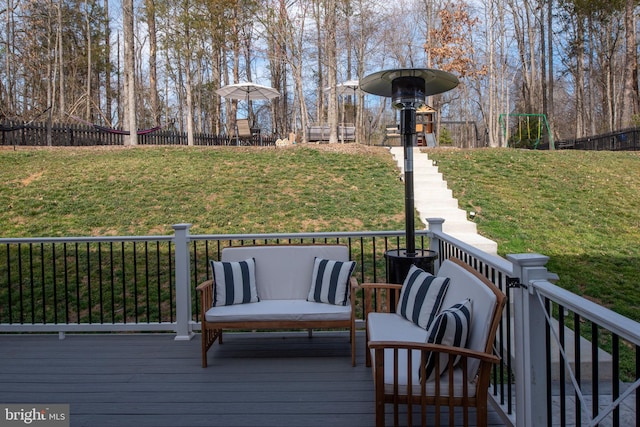 wooden terrace with a yard and fence