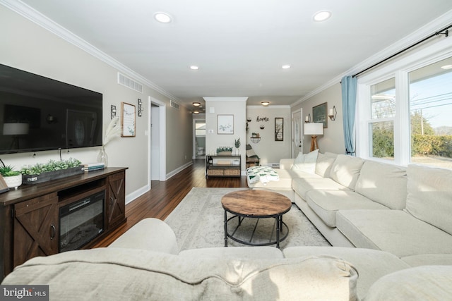 living room featuring ornamental molding, dark wood-type flooring, visible vents, and recessed lighting