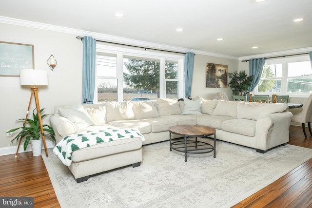 living room featuring recessed lighting, crown molding, and wood finished floors