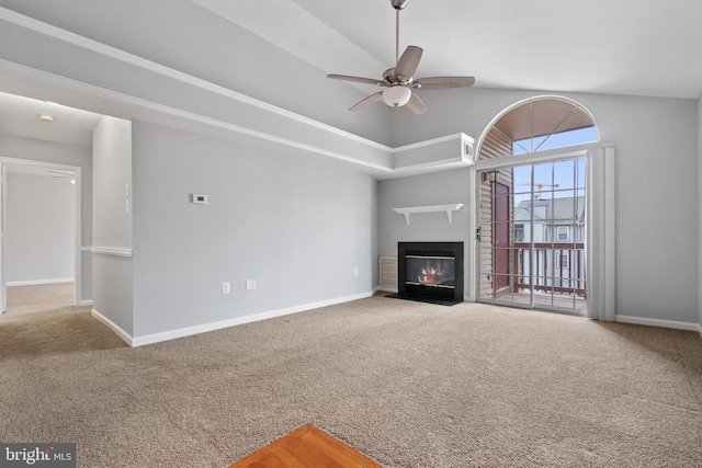 unfurnished living room with a fireplace with flush hearth, a ceiling fan, baseboards, and carpet floors