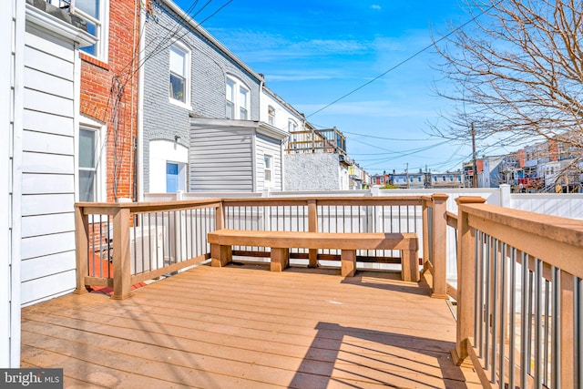 wooden deck with a residential view