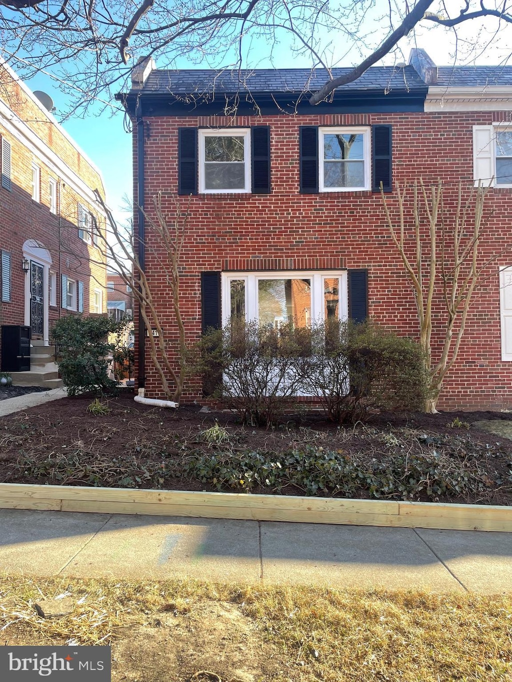 view of home's exterior featuring cooling unit and brick siding