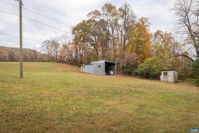 view of yard featuring an outbuilding and a pole building