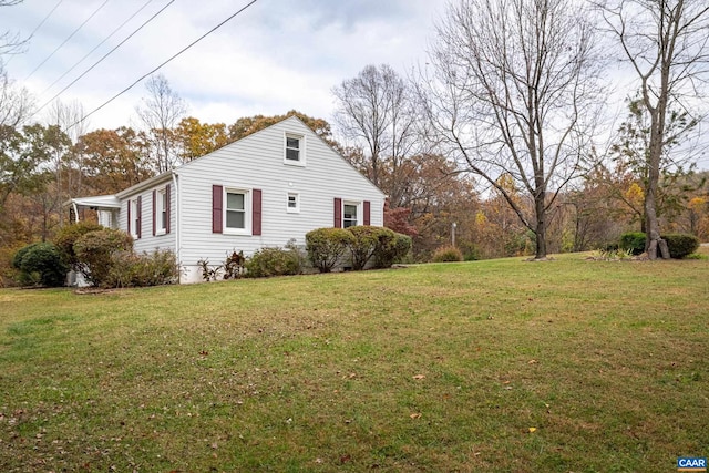 view of property exterior with a lawn