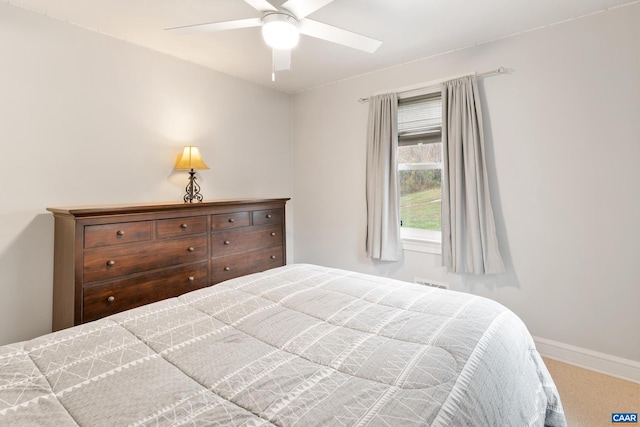 bedroom with carpet flooring, a ceiling fan, and baseboards