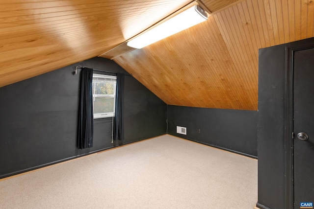 bonus room featuring carpet floors, lofted ceiling, wooden ceiling, and visible vents