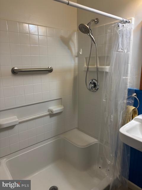 bathroom with a shower with curtain