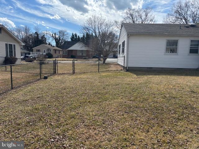 view of yard with a residential view and fence