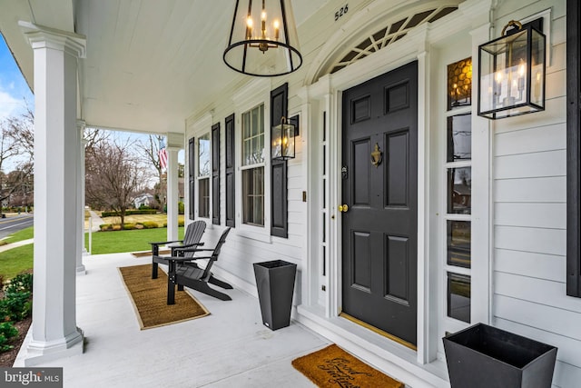 doorway to property featuring a porch