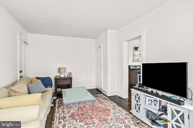 living area with dark wood-style flooring