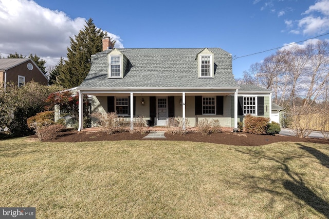 cape cod house featuring a chimney, a porch, roof with shingles, and a front yard