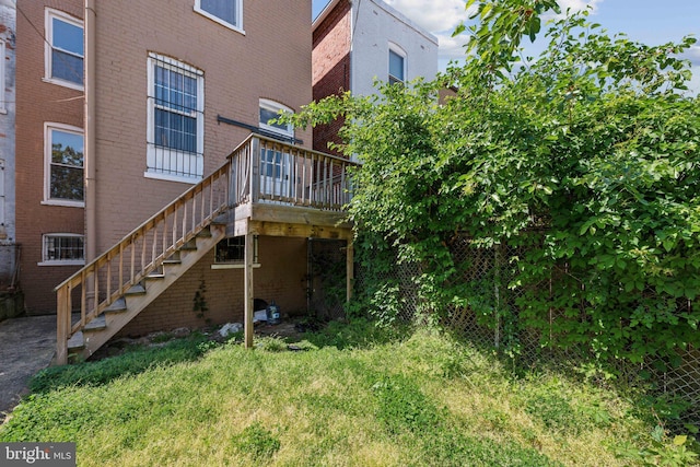 1306 E St NE, Washington, DC 20002 - rear view of house with brick siding, a deck, and stairs