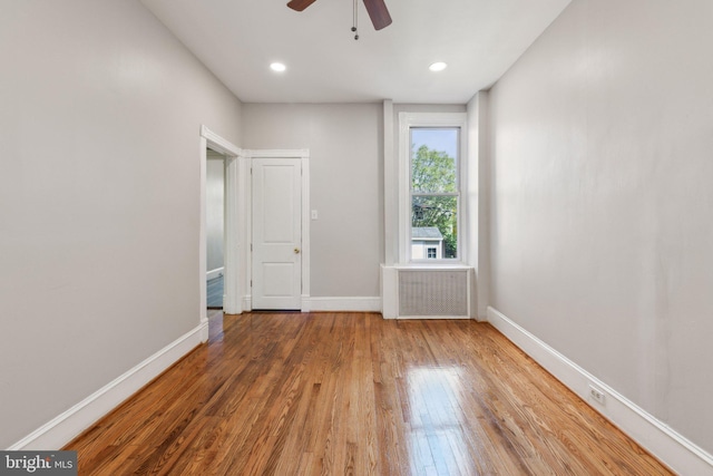 1306 E St NE, Washington, DC 20002 - spare room with radiator, baseboards, ceiling fan, wood finished floors, and recessed lighting