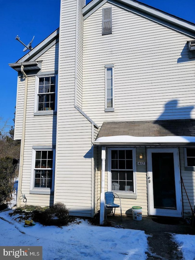 view of snow covered house