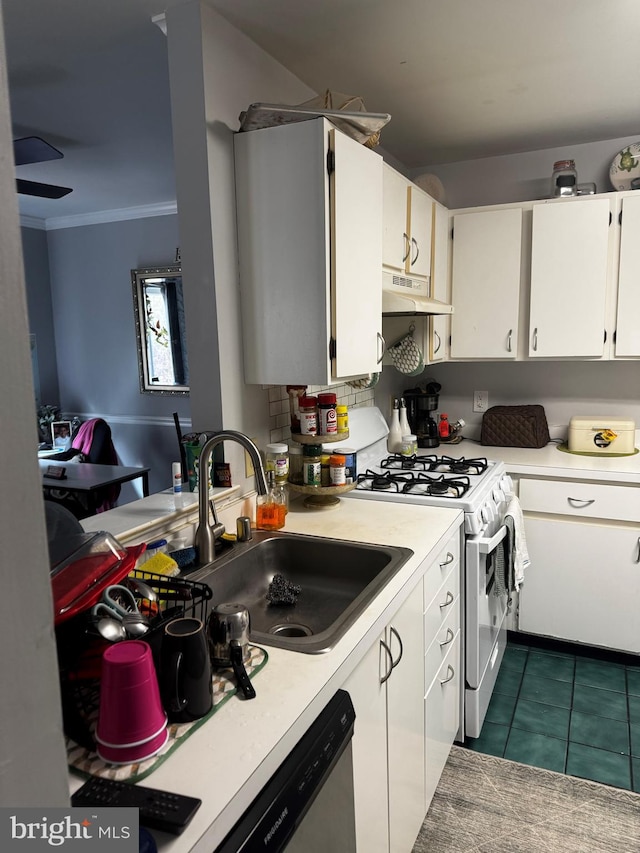 kitchen featuring white range with gas cooktop, ornamental molding, under cabinet range hood, a sink, and white cabinetry