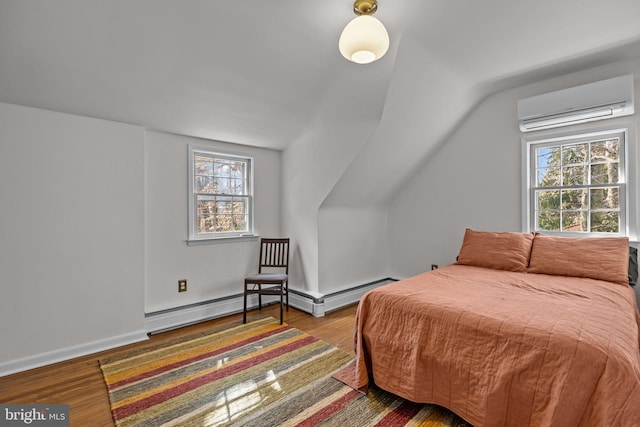 bedroom featuring lofted ceiling, an AC wall unit, wood finished floors, and baseboards