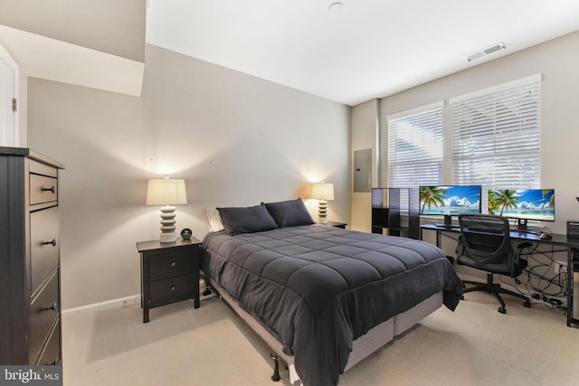 bedroom featuring baseboards, electric panel, visible vents, and light colored carpet