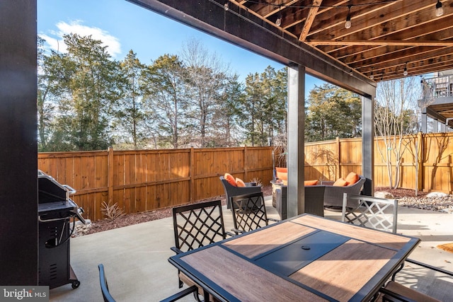 view of patio / terrace featuring outdoor dining space and a fenced backyard