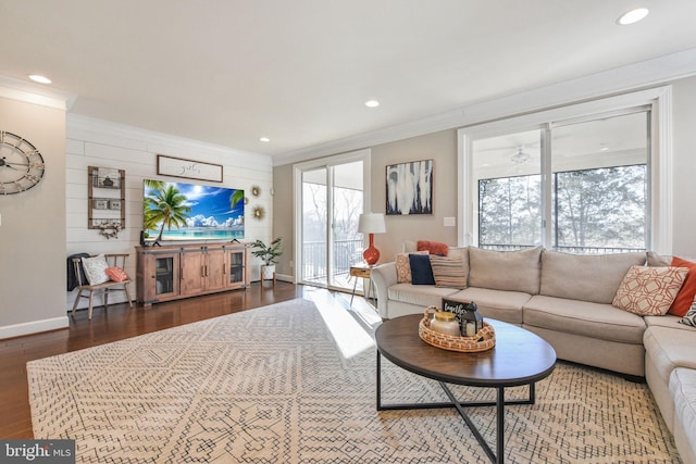 living room with recessed lighting, wood finished floors, and crown molding