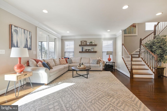 living room with ornamental molding, stairway, wood finished floors, and a wealth of natural light