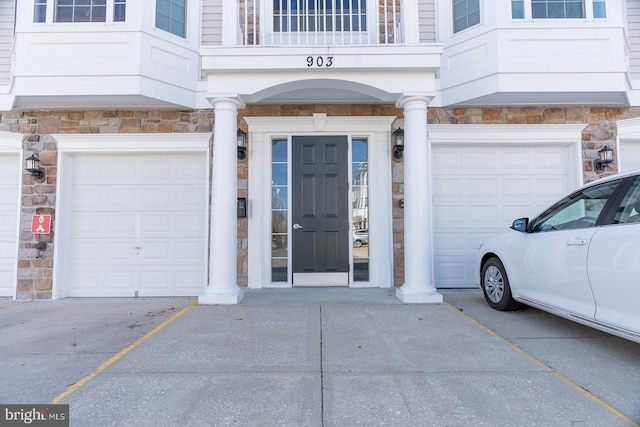 property entrance with stone siding