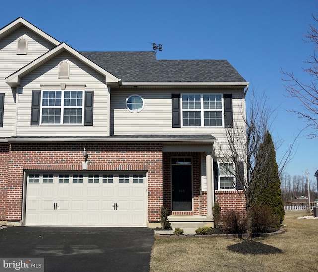 view of front of property featuring a garage, brick siding, roof with shingles, and driveway