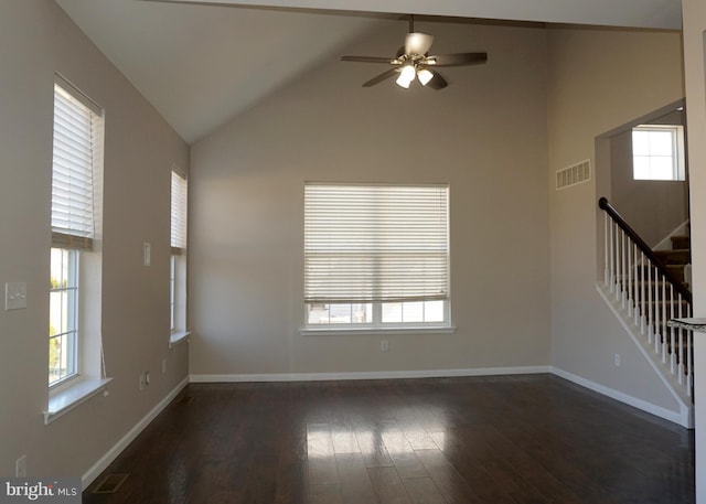 unfurnished room with visible vents, stairs, baseboards, ceiling fan, and dark wood-style flooring