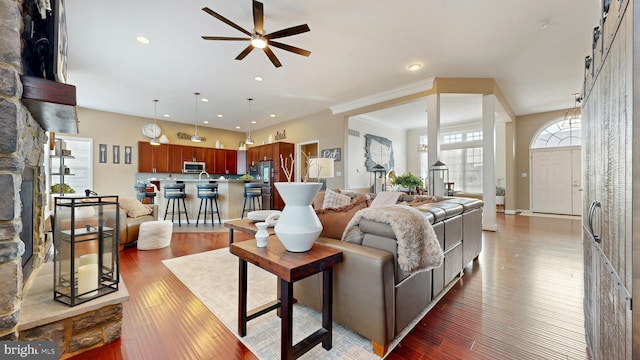 living room with recessed lighting, a ceiling fan, and hardwood / wood-style floors