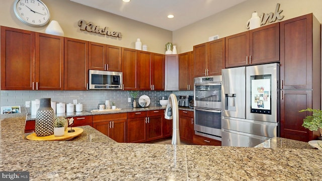 kitchen featuring backsplash, light stone countertops, recessed lighting, and appliances with stainless steel finishes