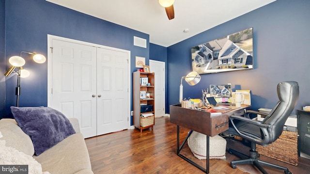 office space with visible vents, baseboards, wood finished floors, and a ceiling fan