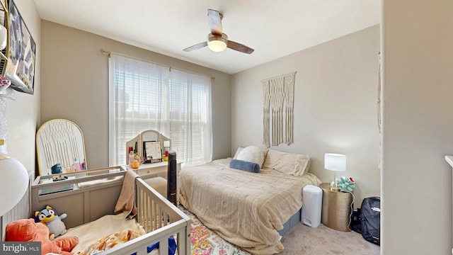 carpeted bedroom featuring ceiling fan