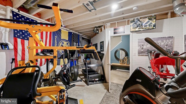 workout room with brick wall