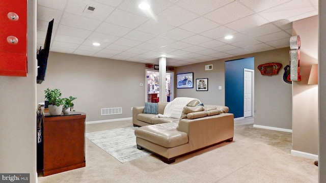 carpeted living area featuring recessed lighting, visible vents, and baseboards