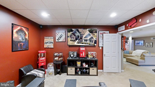 interior space featuring carpet, visible vents, and a drop ceiling