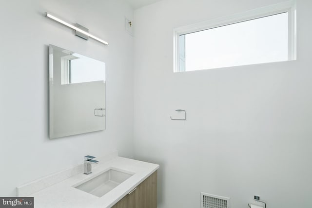 bathroom with visible vents and vanity