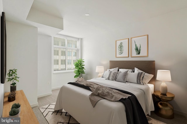 bedroom featuring light colored carpet and baseboards