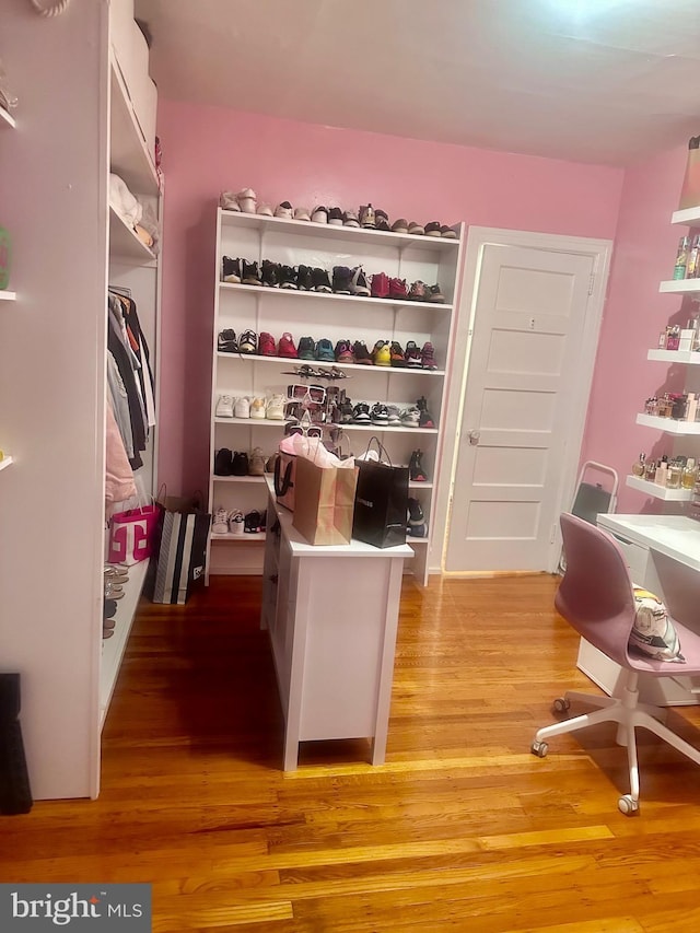 spacious closet featuring light wood-type flooring