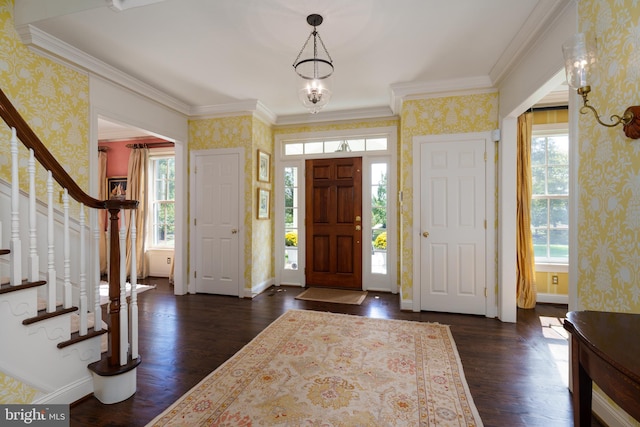 foyer featuring wallpapered walls, plenty of natural light, and dark wood-style floors