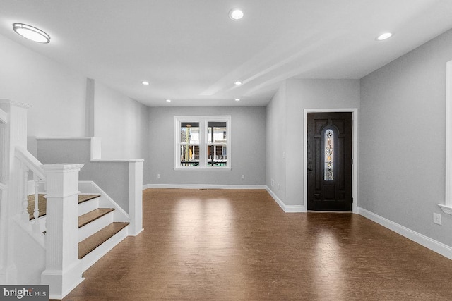 entrance foyer featuring stairs, recessed lighting, baseboards, and wood finished floors