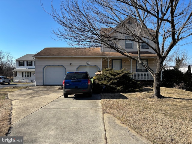 view of property exterior with an attached garage, covered porch, and concrete driveway