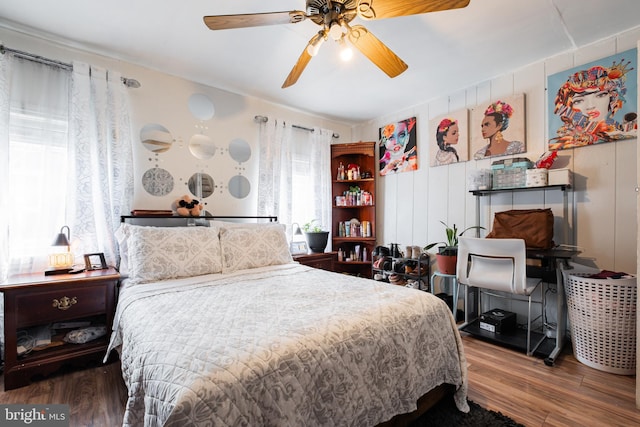 bedroom with ceiling fan and wood finished floors