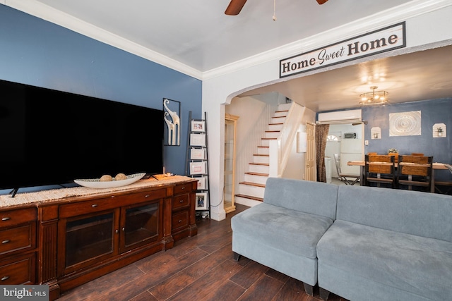 living room with arched walkways, a wall unit AC, dark wood-style flooring, stairs, and ornamental molding