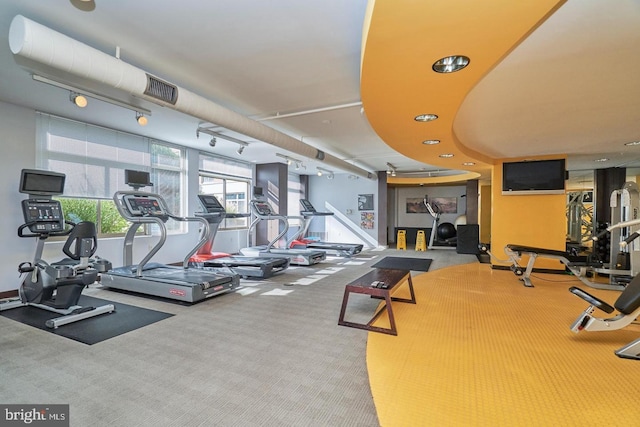 exercise room featuring carpet floors, recessed lighting, visible vents, and track lighting