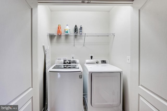 laundry area featuring laundry area and washer and clothes dryer